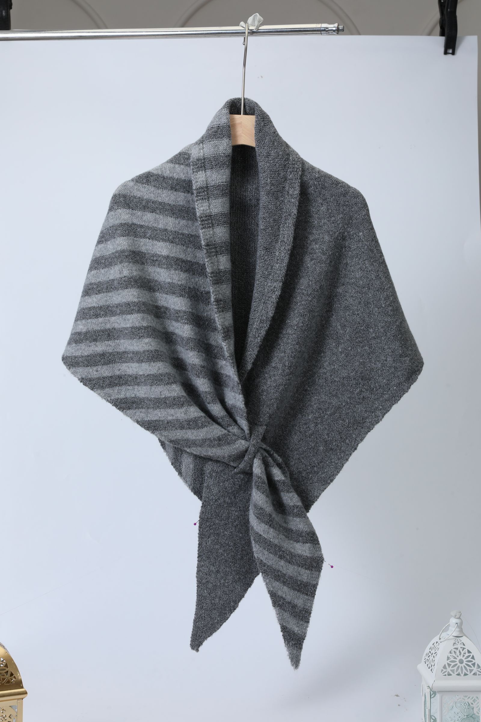Portrait styled with a finely patterned woven shawl